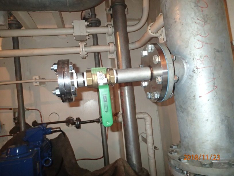 Installation team working on vessel piping