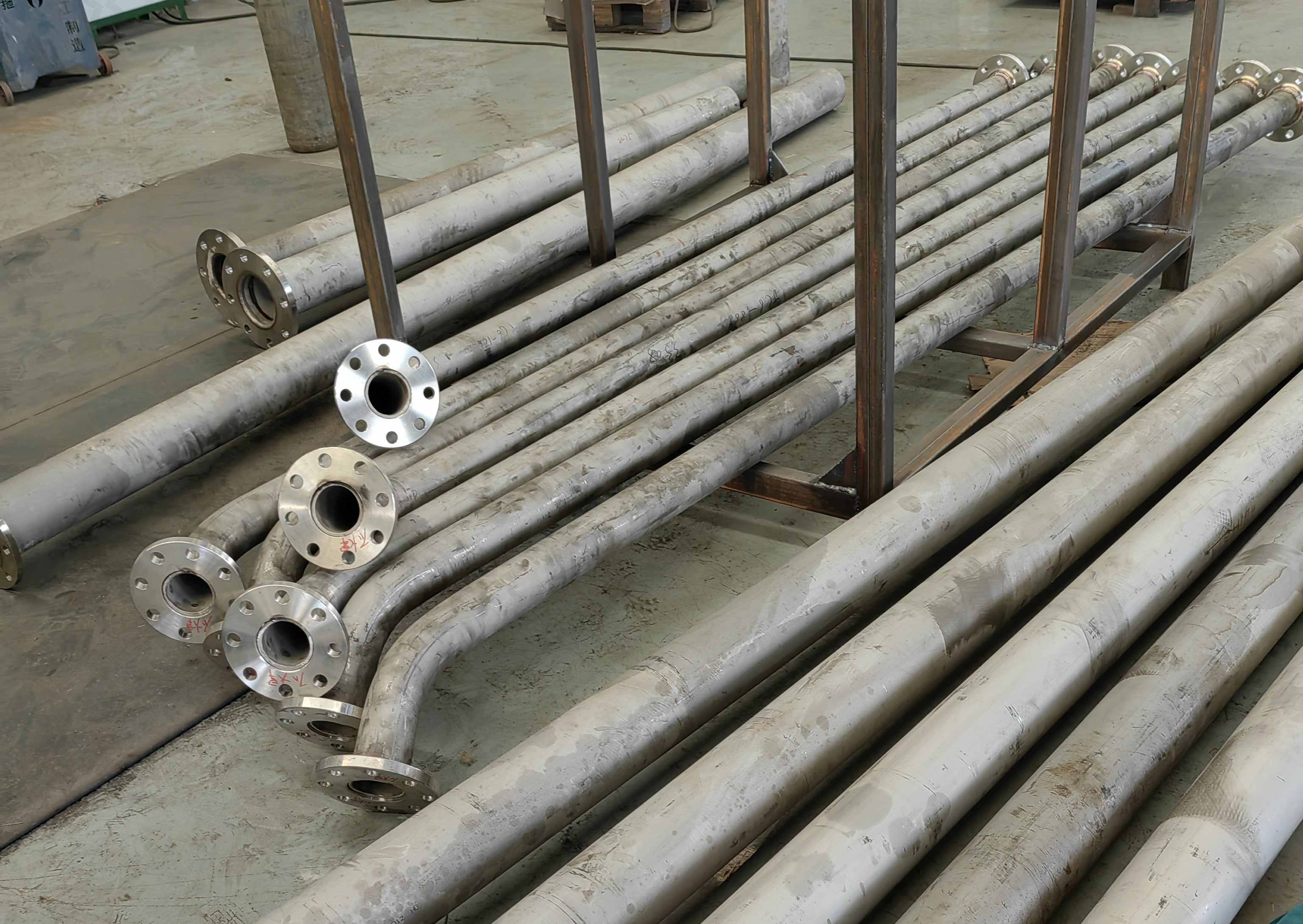 Welded pipe elbow in workshop